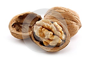 Walnuts and cracked walnut isolated on white