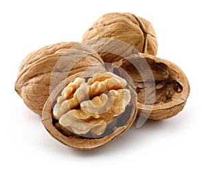 Walnuts and cracked walnut isolated on white