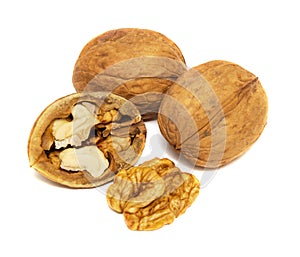 Walnuts and cracked walnut isolated on the white background