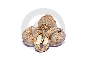 Walnuts and a cracked walnut isolated on white background. Nuts flat lay, top view, perspective presentation,