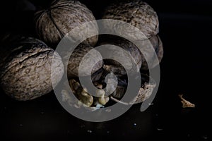 Walnuts on a dark black background