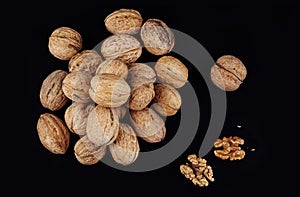 Walnuts isolated on black background