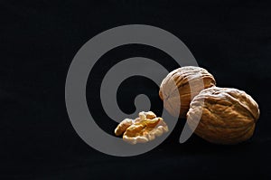 Walnuts Isolated on Black Background with copy space