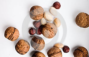 Walnuts and kernels on a white background, healthy eating and vegetarianism.