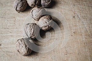 Walnuts laying on a wooden cutting board