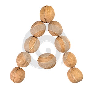 Walnuts lined in the shape of the letter "A" isolated on white