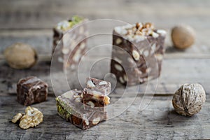 Walnuts and nut halva on a rustic wooden table