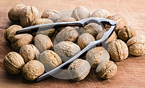 Walnuts and Nutcracker on a Cutting Board