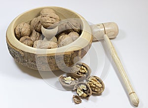 Walnuts. Nuts of walnuts with nutcracker. white backgro