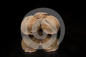 Walnuts on reflective surface