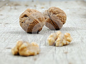 Walnuts On Rustic Old Wooden Table photo