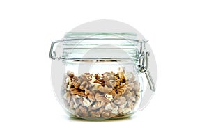 Walnuts stored inside the closable glass bottle