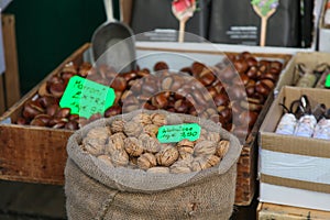 Walnuts in street market and marroni photo