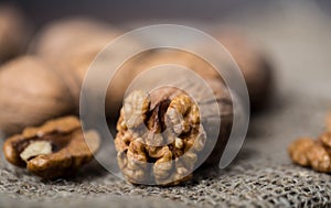 Walnuts. Walnut kernels and whole walnuts on rustic table.