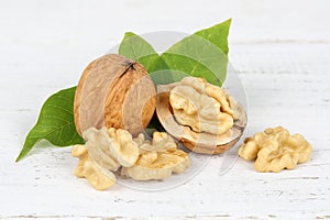 Walnuts walnut nuts nut nutshell on wooden board