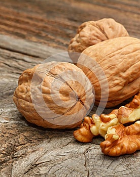 Walnuts on wooden background