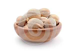 Walnuts in a wooden bowl isolated