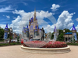 The Walt Disney and Mickey Mouse partner statue in front of Cinderella`s castle in Magic Kingdom