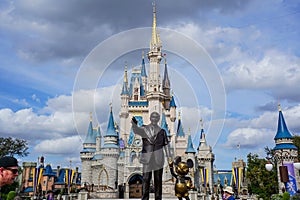 Walt Disney and Mickey Mouse Partners statue in front of Cinderellas Castle