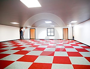 Wanaka, New Zealand - Febr 5, 2015: father with his daughter in the Ames forced perspective room.