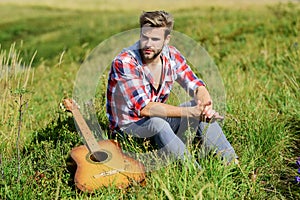 Wanderlust concept. Summer vacation highlands nature. Peaceful mood. Guy with guitar contemplate nature. Inspiring