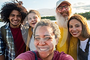 Wanderlust lifestyle, selfie, Multiracial young group of trendy people having fun together on vacation - Diverse
