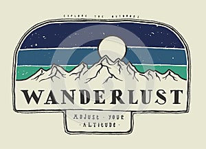 Wanderlust - mountain range typography badge photo