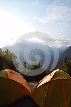 Wanderlust with tents in the mountains on a beautiful morning