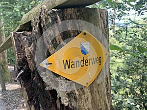 Wanderweg sign in yellow close to Zurich, Switzerland. Official hiking path indication photo