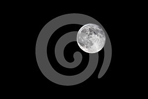 Waning gibbous, nearly full, moon on black background