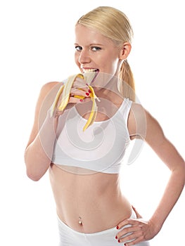 Wanna some? A starving woman eating banana