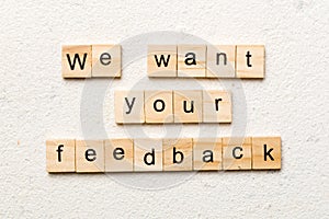 We want your feedback word written on wood block. We want your feedback text on cement table for your desing, Top view