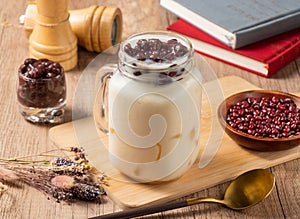 Wantan Red Bean Soy Milk Duo served in jar isolated on table top view of asian food photo