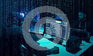 Wanted hackers coding virus ransomware using laptops and computers. Cyber attack, system breaking and malware concept.