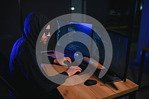Wanted hackers coding virus ransomware using laptops and computers. Cyber attack, system breaking and malware concept