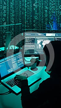Wanted hackers coding virus ransomware using laptops and computers. Cyber attack, system breaking and malware concept.