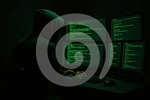 Wanted hackers coding virus ransomware using laptops and computers. Cyber attack, system breaking and malware concept.
