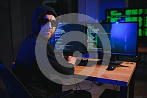 Wanted hackers coding virus ransomware using laptops and computers. Cyber attack, system breaking and malware concept