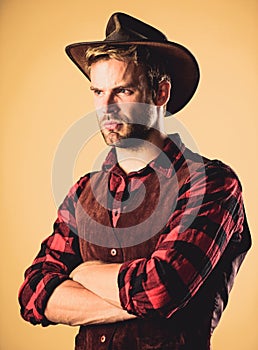 Wanted. western cowboy portrait. man checkered shirt on ranch. Vintage style man. Wild West retro cowboy. cowboy in photo