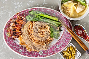 Wanton noodle with barbecue pork, vegetable and dumpling, popular Chinese food