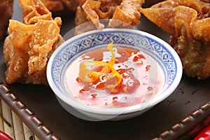 Wantons and bowl of chili photo