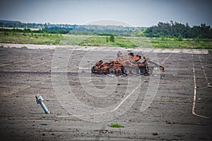 War, destroyed tank near Airport ruins in Donbass photo