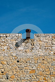 War cannon on a castle wall overlooking a narrow sea.with copy space