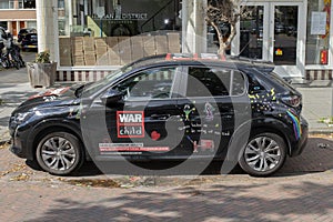 War Child Advertisement On A Car At Amsterdam The Netherlands 8-7-2024