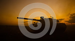 War Concept. Military silhouettes fighting scene on war fog sky background, World War German Tanks Silhouettes Below Cloudy Skylin