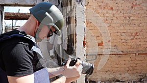 War correspondent photographs destroyed buildings after the bombing