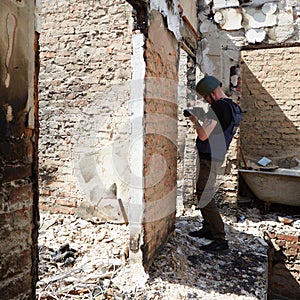 War correspondent photographs destroyed buildings after the bombing