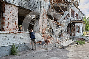 War correspondent photographs destroyed buildings after the bombing