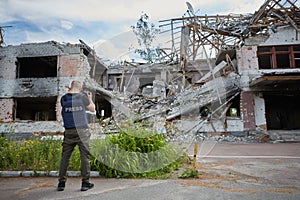 War correspondent photographs destroyed buildings after the bombing