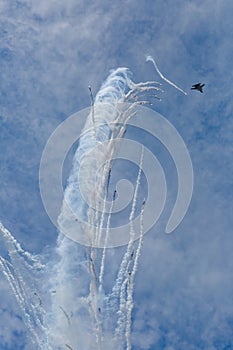 War jet plane showing aerobatics photo